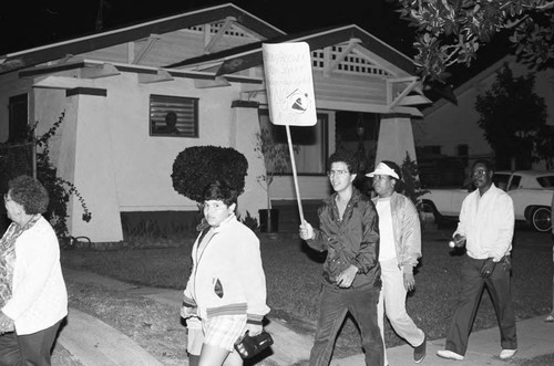 Neighborhood watch group marching against drugs and crime, Los Angeles, 1986