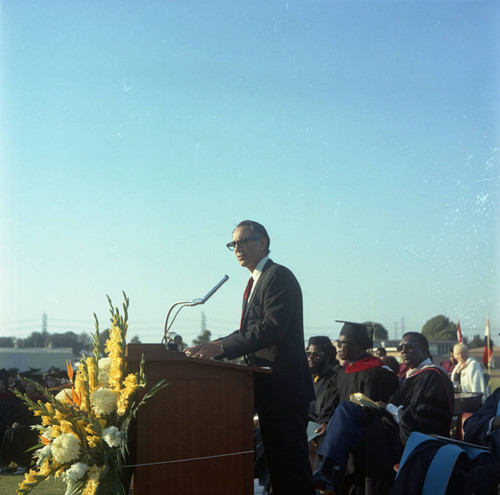 Speaker addressing the audience during Compton College commencement, Compton, 1972