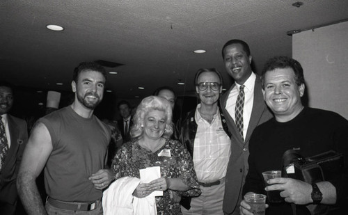 Jamaal Wilkes posing with others at a special event, Los Angeles, 1988