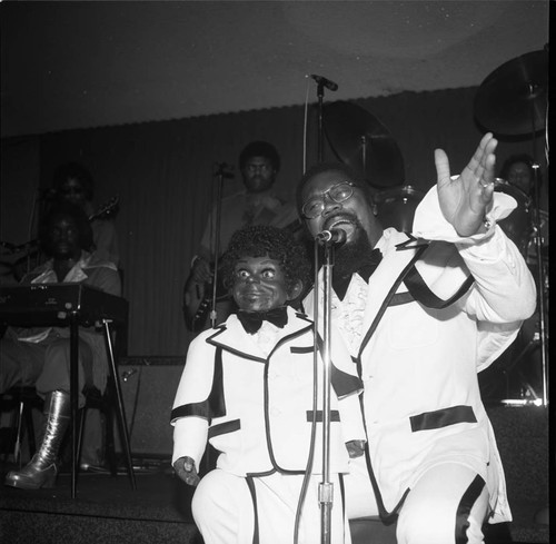 Ventriloquist and his dummy performing, Los Angeles