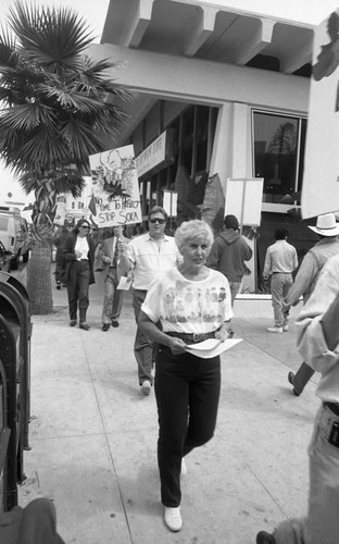 People picketing in front of a Soka Gakkai International exhibition, Los Angeles, 1993