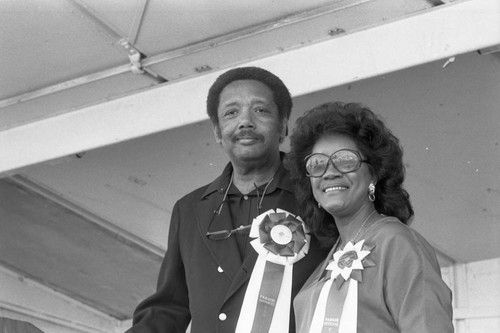 Officials of the 16th annual Easter parade posing together, South Central Los Angeles, 1984