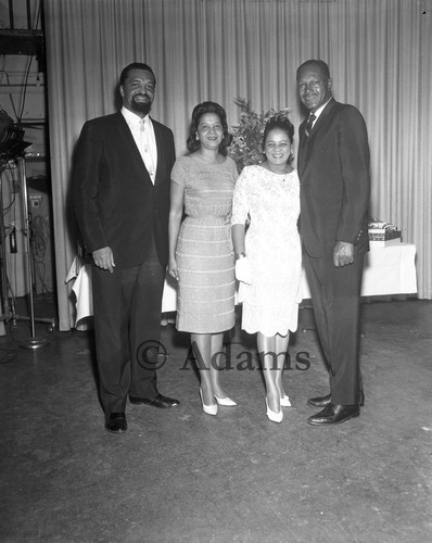 Tom Bradley posing with Doll League Charity Club officers, Los Angeles, 1964