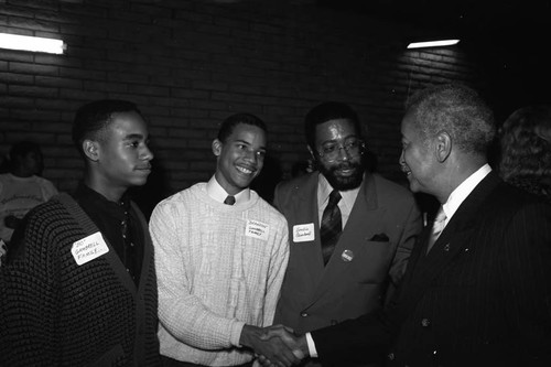 Bondie, Bo, and Brandon Gambrell talking with David Dinkins, Los Angeles, 1989