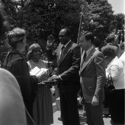 Rose Bird administering the oath of office to Tom Bradley, Los Angeles, 1977