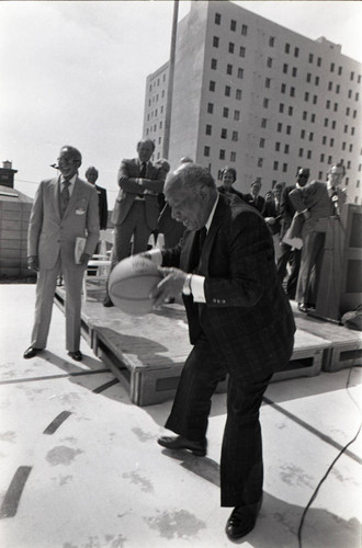 Gil Lindsay dribbling a basketball at a Community Redevelopment Agency project site, Los Angeles, 1981