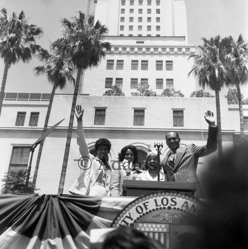 Tom Bradley and his family waving to the crowd during his inauguration, Los Angeles, 1973