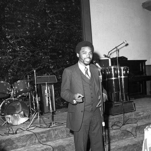 Michael Morris speaking during his birthday celebration, Compton, ca. 1974