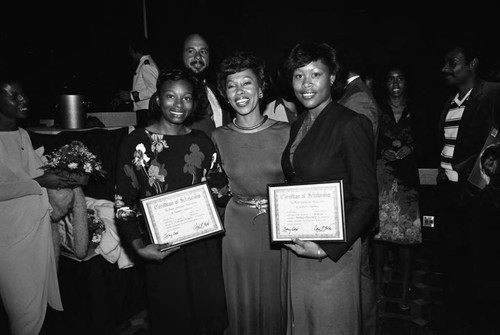 Maxine Waters posing with scholarship recipients at a Black Journalist Association event, Los Angeles, 1981