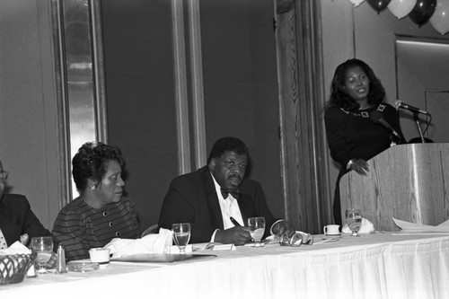 Woman speaking at the Brookins Community AME 12th anniversary banquet, Los Angeles, 1989