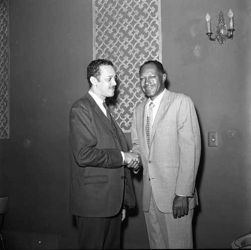 Channing E. Phillips posing with Tom Bradley during a mayoral campaign event, Los Angeles, 1969