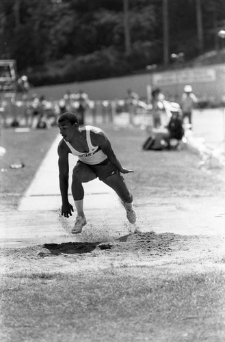 Athlete completing a long jump, Los Angeles, 1982