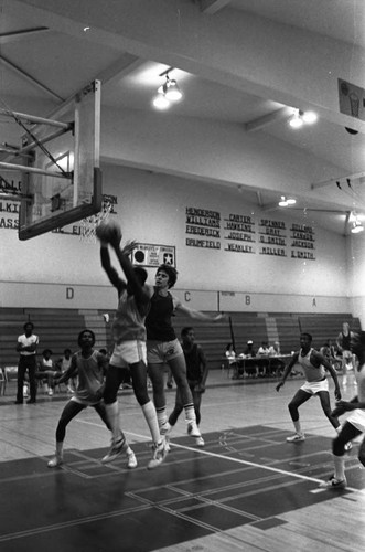 Crenshaw High School basketball players in action on the court, Los Angeles, 1983