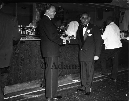 Shaking hands, Los Angeles, 1955