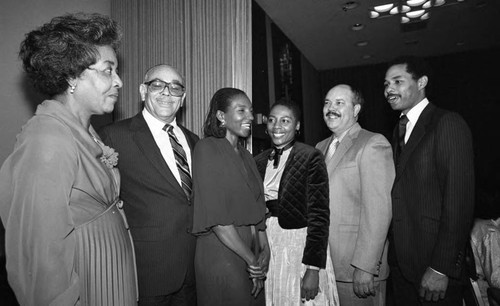 Myrlie Evers talking with Larry Carroll and others, Los Angeles, 1983