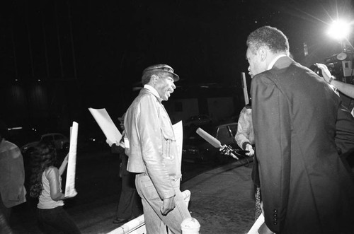 A reporter interviewing a protester during the NAACP Image Awards; Los Angeles, 1981