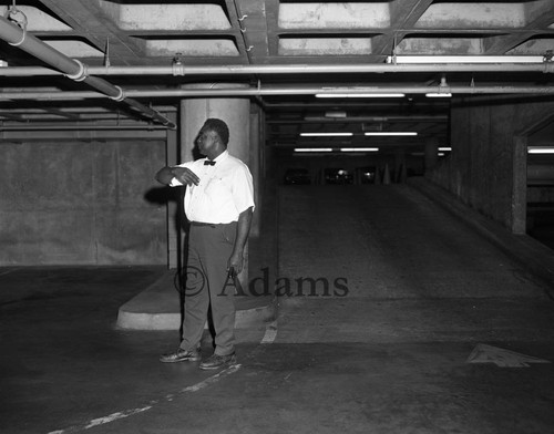 Parking attendant in garage, Los Angeles 1970