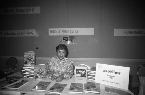 Black Women's Forum participant selling Eula McClaney's memoir, Los Angeles, 1989