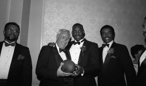 Doug Williams, Jim Hill and Stu Nahan posing together at a 100 Black Men tribute, Los Angeles, 1988