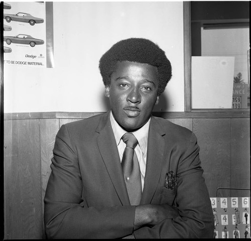 African American automobile salesman posing for a portrait, Los Angeles, 1971