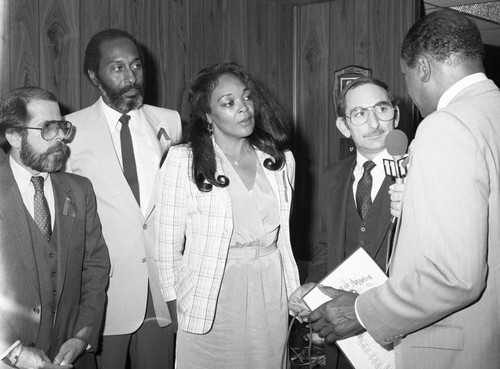 Television reporter interviewing Tom Bradley, Los Angeles, 1983