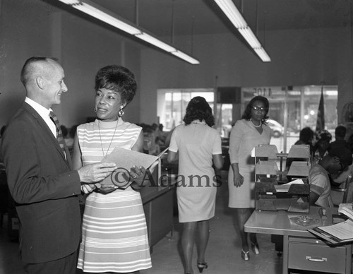 Man and woman in office, Los Angeles, 1968