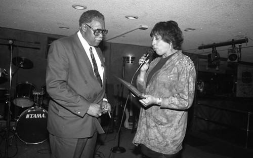 Reve Gipson presenting an award to Guy Crowder, Los Angeles, 1993