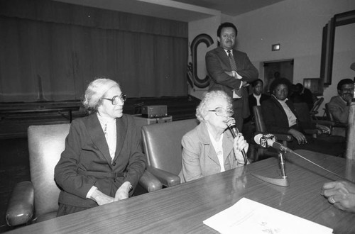 Rosa Parks listening to Lillian Rogers Parks speak during a Compton Unified School District event, Los Angeles, 1983