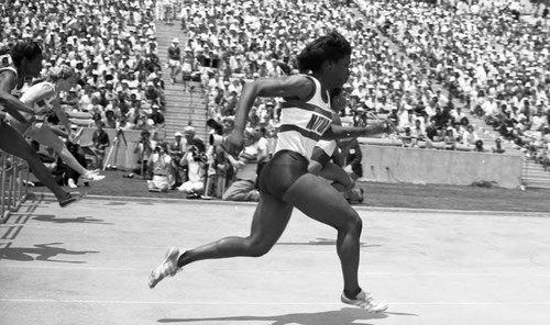 Women clearing hurdles during a track event at Drake Stadium, Los Angeles