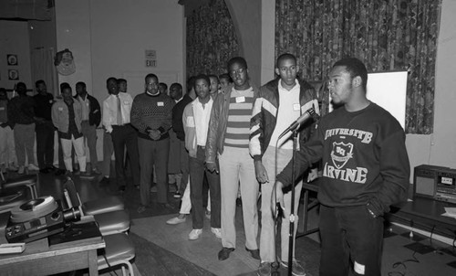 Young men waiting in line to speak, Los Angeles, 1986