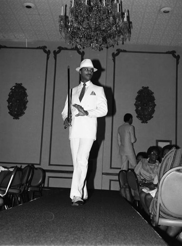 Lula Fields modeling student walking the runway during graduation, Los Angeles, 1985