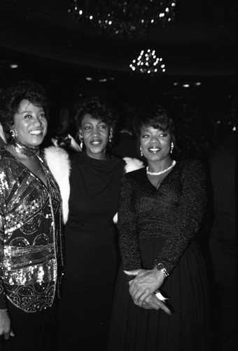 Maxine Waters, Marla Gibbs, and Oprah Winfrey posing together a Black Women's Forum event, Los Angeles, 1989