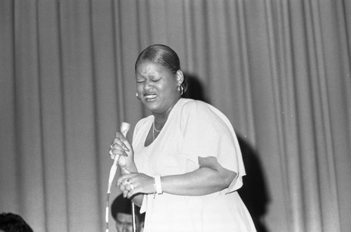 Woman performing at KGFJ's Soul Search event, Los Angeles, 1975