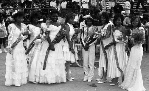 Locke High School Homecoming Queen and her court posing together, Los Angeles, ca. 1989