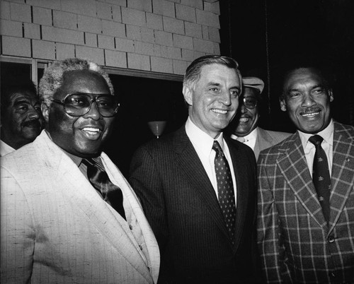 Walter Mondale posing with Ed Lara, Los Angeles. ca. 1984