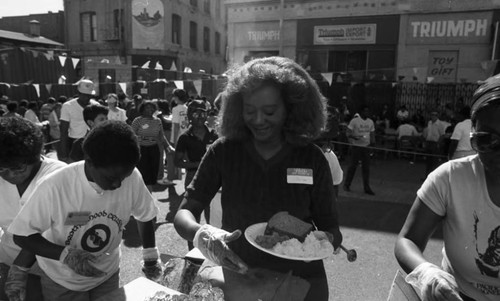 Friends feeding friends, Los Angeles, 1986