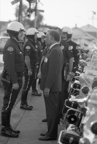 Jessie Brewer reviewing LAPD motorcycle officers, Los Angeles, 1983