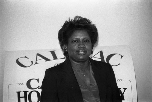 Shirley Ford standing in front of a Cal-Pac sign, Los Angeles, 1985