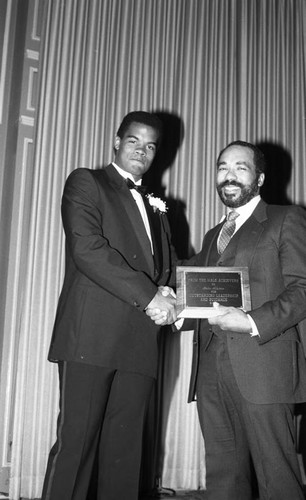 Young man in a tuxedo receiving an award, Los Angeles, 1987