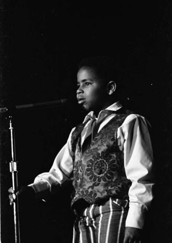 Marc Copage performing on stage, Los Angeles, 1970