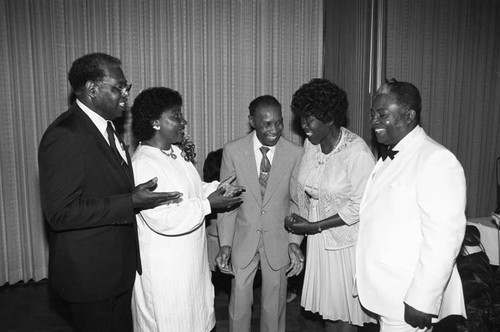 Honorees of the Watts Branch NAACP Freedom Fund Banquet talking together, Los Angeles, 1984