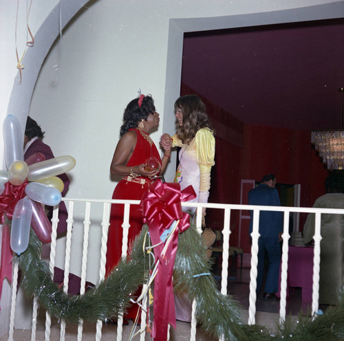 Two women talking at Berry Gordy's New Year's Eve party, Los Angeles