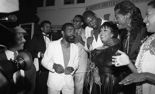 Gertrude Gipson-Penland celebrating her birthday with Magic Johnson, Los Angeles, 1987