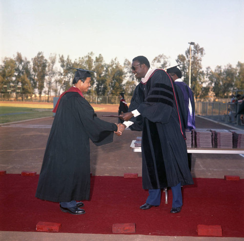 Compton College graduate receiving his diploma, Los Angeles, 1972