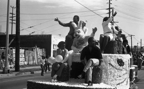 People waving from a float during the South Central Los Angeles Easter Parade, Los Angeles, 1983