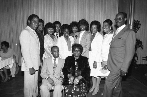 James H. Hawkins Sr. and Elsie Hawkins posing with family during a Watts Branch NAACP Banquet, Los Angeles, 1984