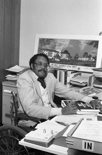 Charles Colfield posing in his office, Los Angeles, 1986