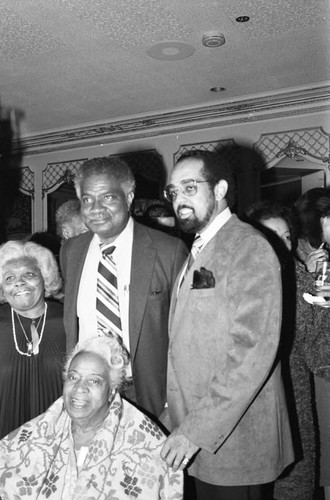 Ossie Davis, John T. MacDonald, III, posing with others, Los Angeles, 1984