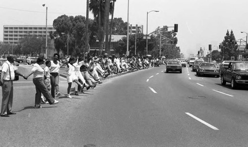 Hands Across America participants lining a city street, Los Angeles, 1986