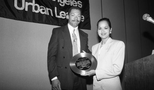 David Cunningham, III presenting an Urban League award for Sam Williams, Los Angeles, 1992